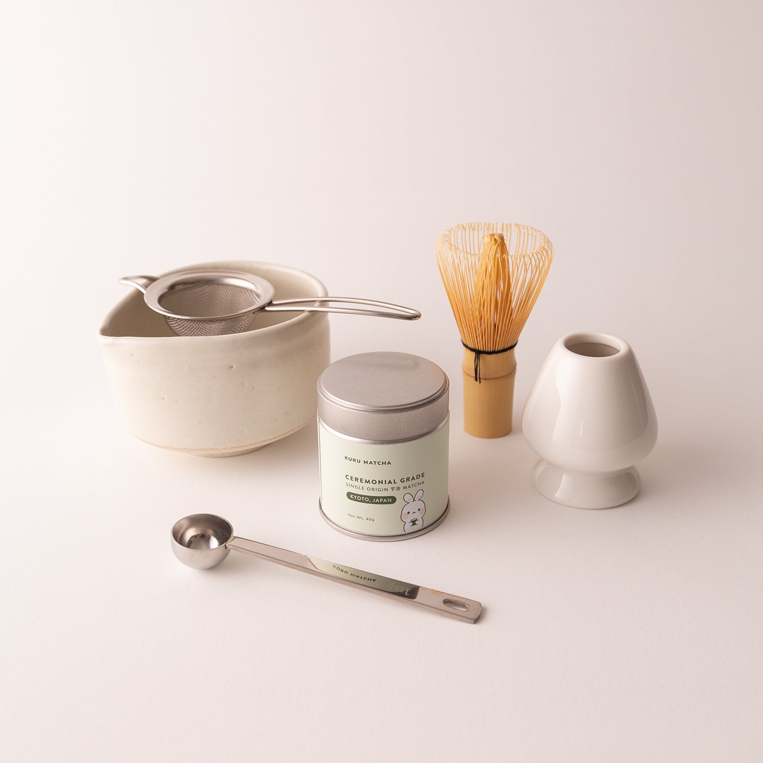 Ceremonial matcha set including a chawan bowl, whisk, naoshi, spoon, and ceremonial matcha powder designed for preparing traditional matcha tea