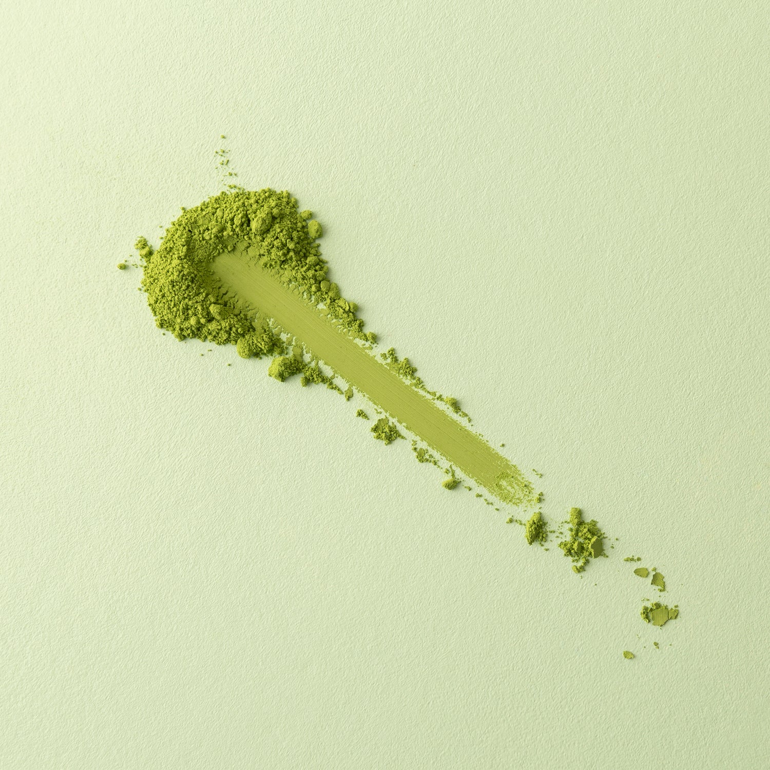 Matcha powder swipe test revealing the fine texture and high quality of organic matcha powder