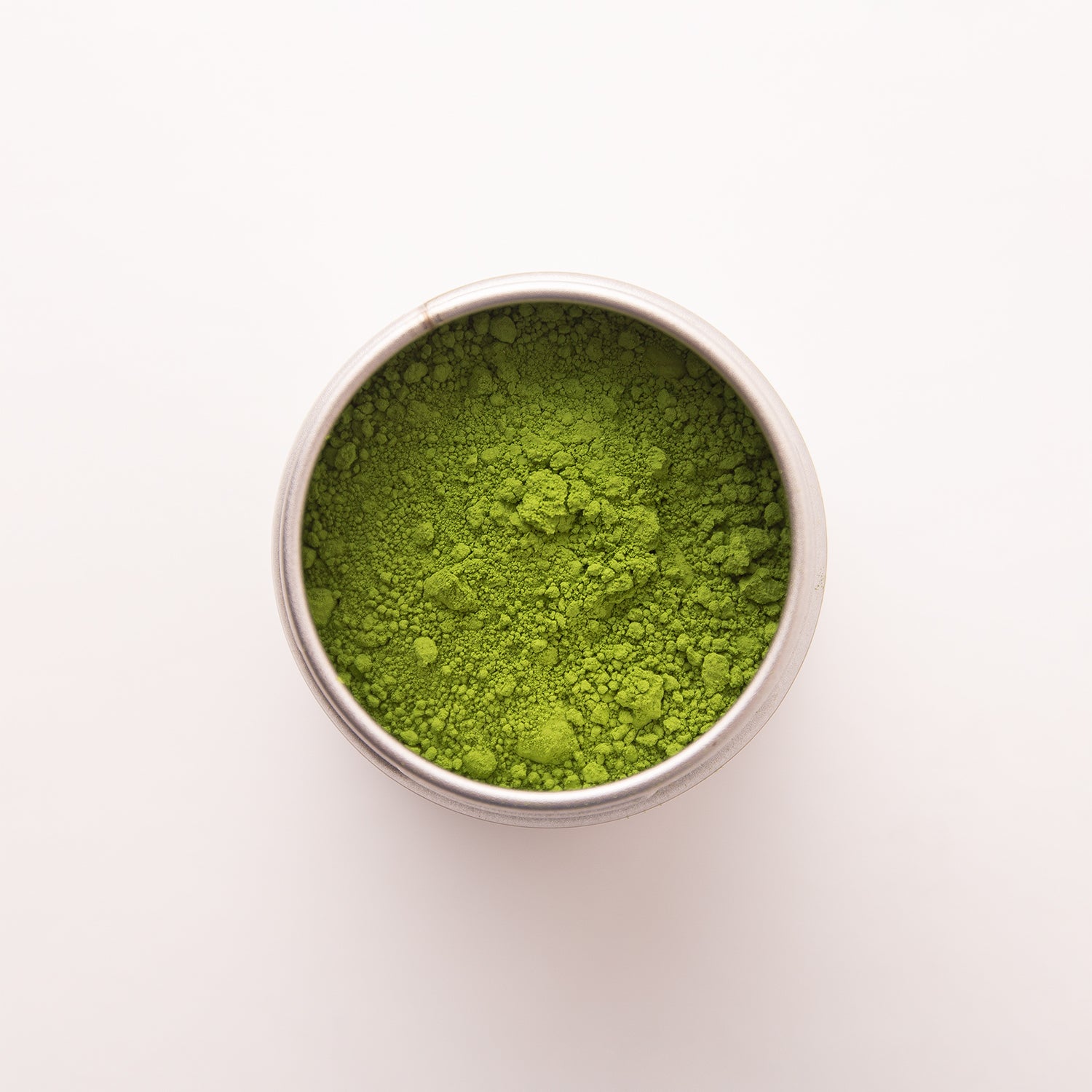 Close-up of vibrant green matcha powder, showing its rich colour and fine texture